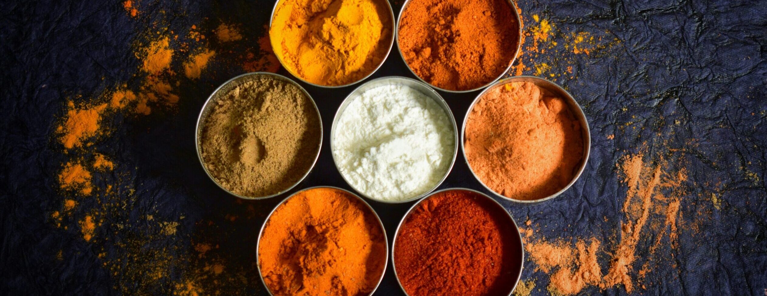 pexels photo 31280796 31280796 Colorful Indian spices in bowls on a textured dark background for culinary concepts.