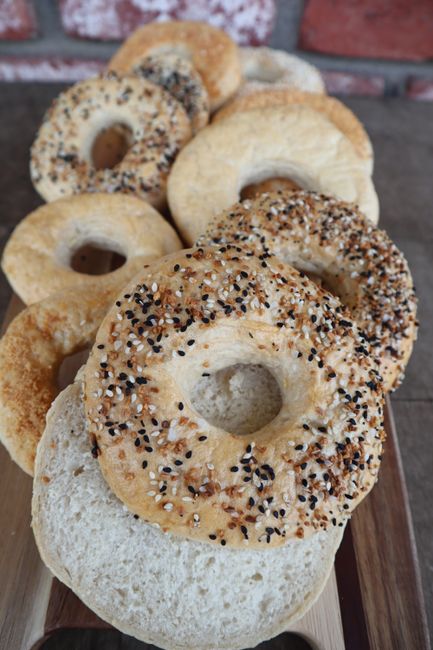 pexels photo 11599632 11599632 Delicious assortment of bagels with seeds, sliced and ready to enjoy.