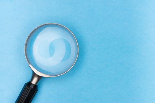 Why More Families Are Choosing Pure, Unadulterated Spices Close-up of a magnifying glass on a blue surface, ideal for search and exploration themes.