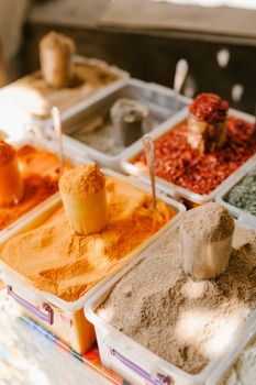 pexels photo 5273011 5273011 From above of assorted condiments and spices in plastic containers selling at bazaar